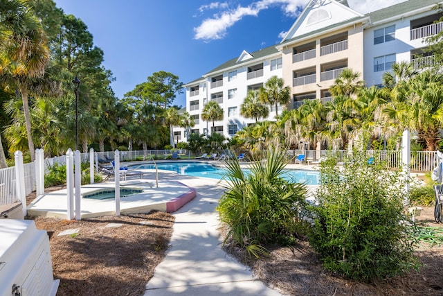 view of pool featuring a hot tub