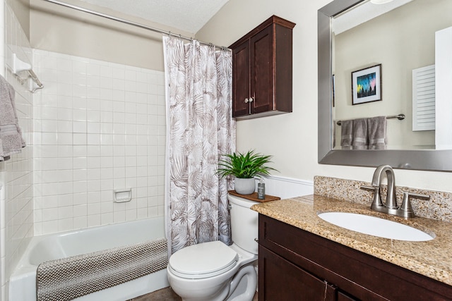 full bathroom with vanity, shower / bath combo with shower curtain, a textured ceiling, and toilet