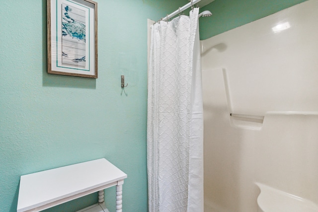 bathroom with a shower with shower curtain