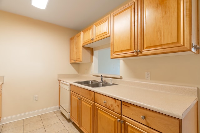 kitchen with light tile patterned flooring, white dishwasher, and sink