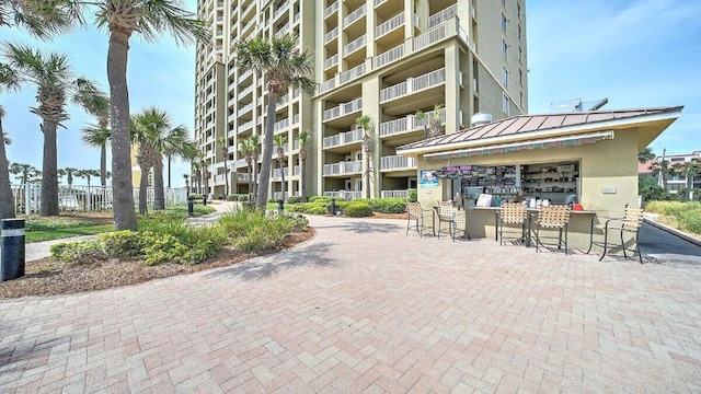 surrounding community featuring an outdoor bar