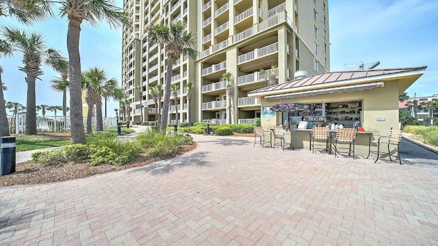 view of community with outdoor dry bar
