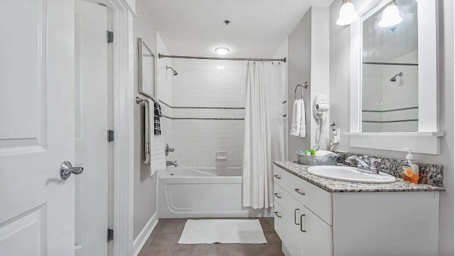 full bathroom featuring shower / tub combo with curtain, tile patterned floors, and vanity