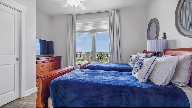 bedroom featuring light hardwood / wood-style floors and ceiling fan