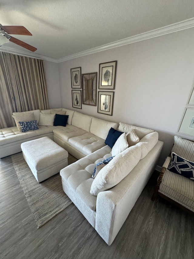 living room with ornamental molding, a textured ceiling, dark hardwood / wood-style floors, and ceiling fan