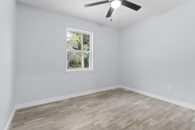 empty room with ceiling fan and light wood-type flooring