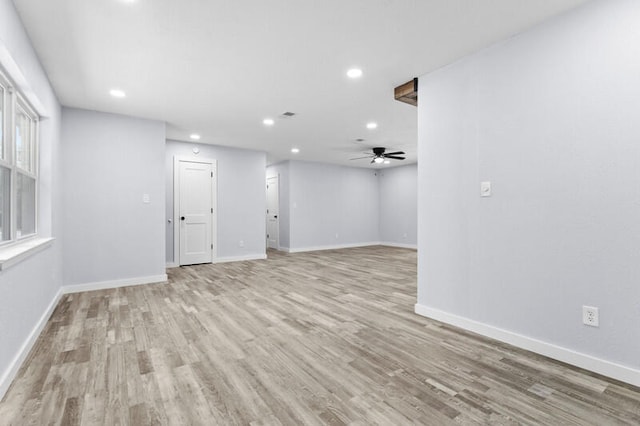 unfurnished room with ceiling fan and light hardwood / wood-style flooring