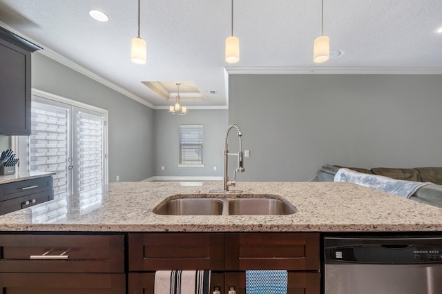 kitchen featuring dishwasher, sink, hanging light fixtures, light stone counters, and ornamental molding