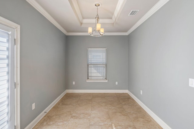 empty room featuring a tray ceiling, crown molding, and a chandelier