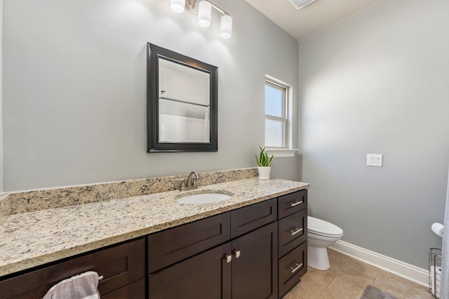 2137 Janet St, Navarre, FL 32566 - bathroom featuring baseboards, vanity, tile patterned floors, and toilet