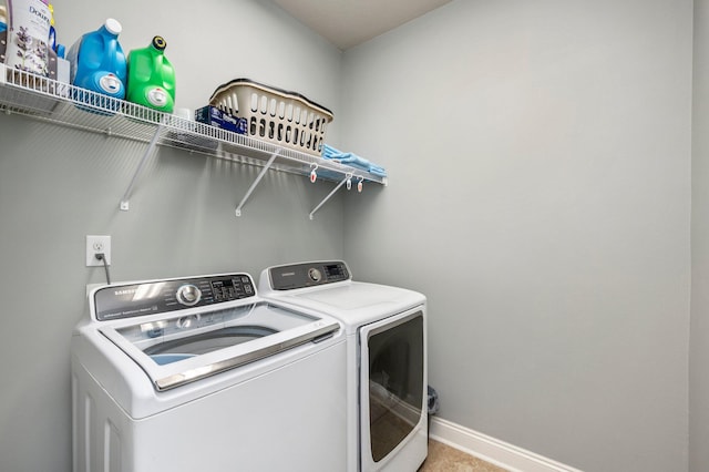 washroom featuring washing machine and dryer