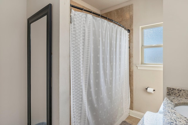 2137 Janet St, Navarre, FL 32566 - full bath with baseboards, curtained shower, a sink, and tile patterned flooring