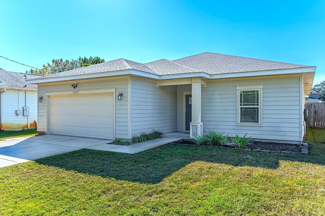 ranch-style home with concrete driveway, a front lawn, an attached garage, and a shingled roof