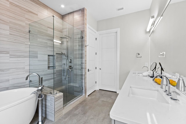 bathroom featuring vanity and plus walk in shower