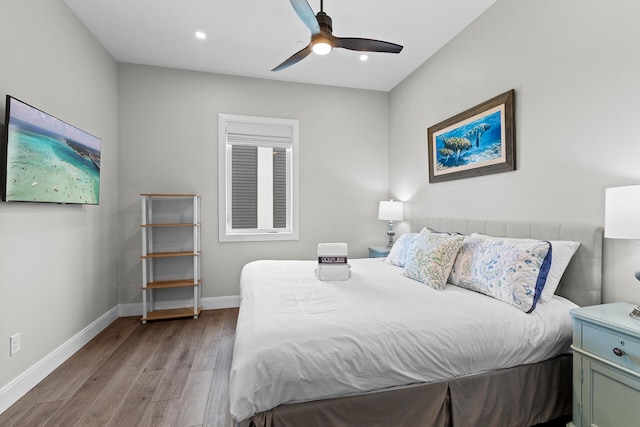 bedroom featuring light hardwood / wood-style floors and ceiling fan