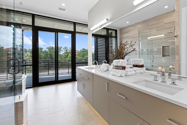 bathroom with vanity, walk in shower, and tile patterned flooring