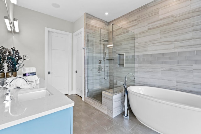 bathroom featuring vanity, tile patterned floors, and independent shower and bath