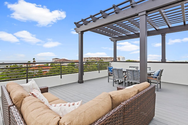 wooden terrace with an outdoor living space and a pergola