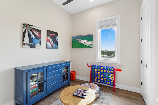 game room featuring light hardwood / wood-style floors and ceiling fan