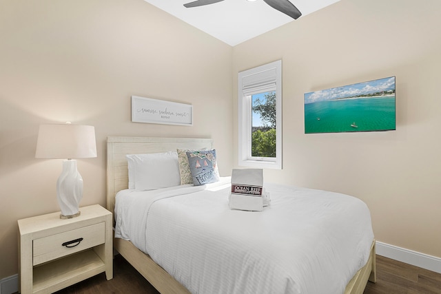 bedroom with lofted ceiling, ceiling fan, and dark hardwood / wood-style flooring