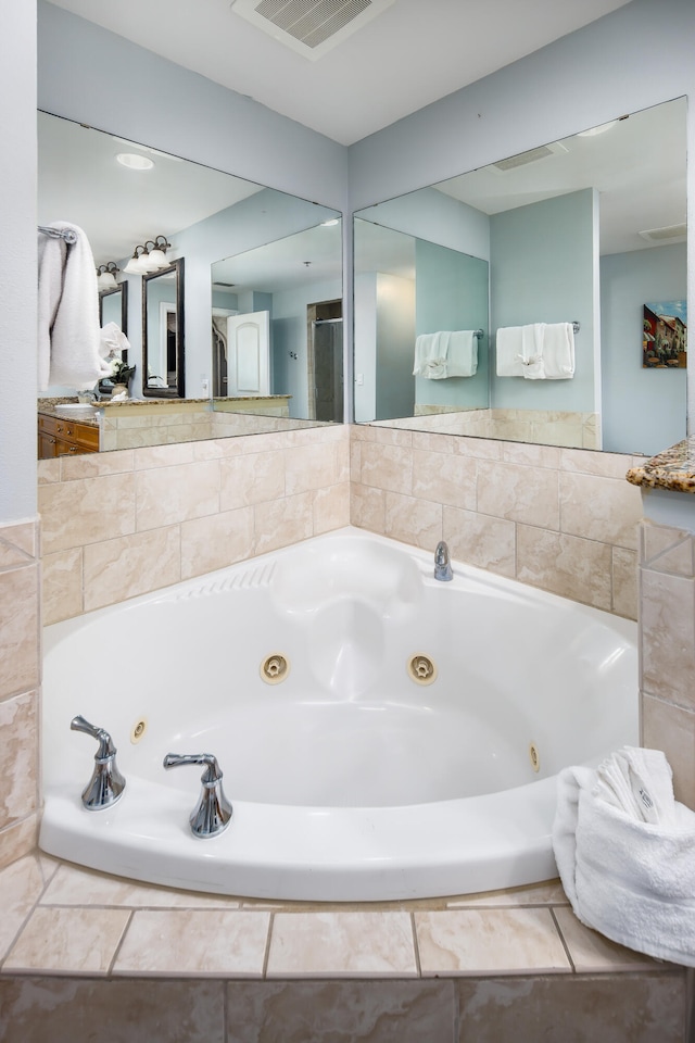 bathroom with tiled bath