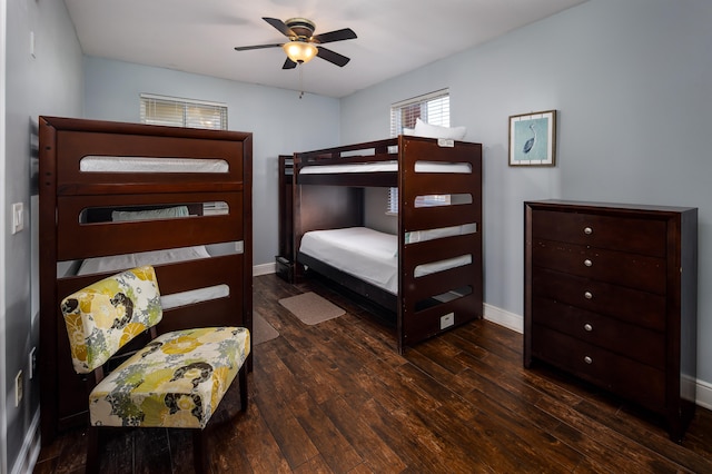 bedroom with dark wood-type flooring and ceiling fan