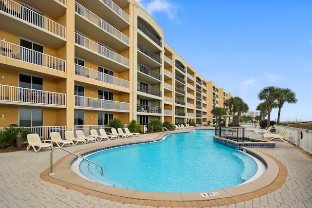 view of pool featuring a patio