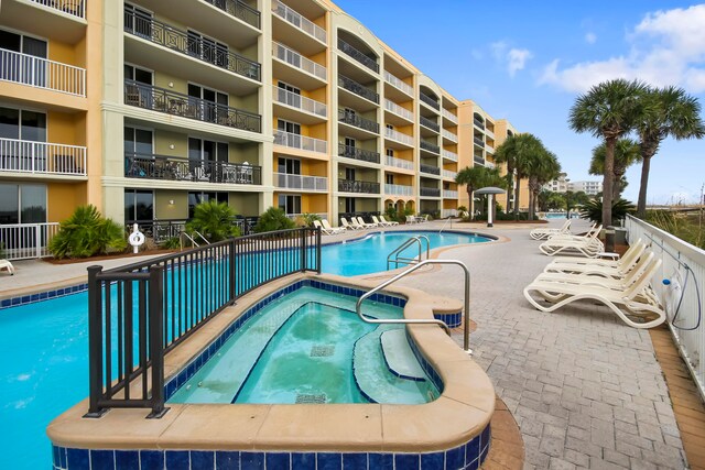 view of swimming pool featuring a patio