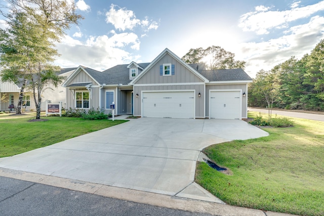 craftsman inspired home featuring a front yard and a garage