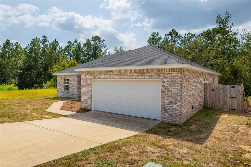 garage with a lawn