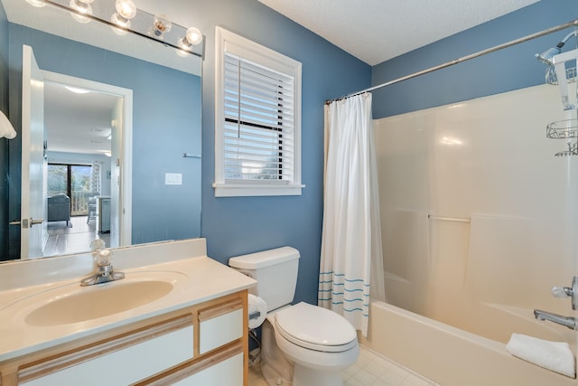 full bathroom featuring vanity, shower / bath combo, a textured ceiling, and toilet