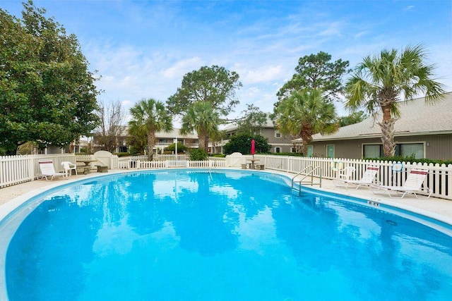 view of swimming pool with a patio