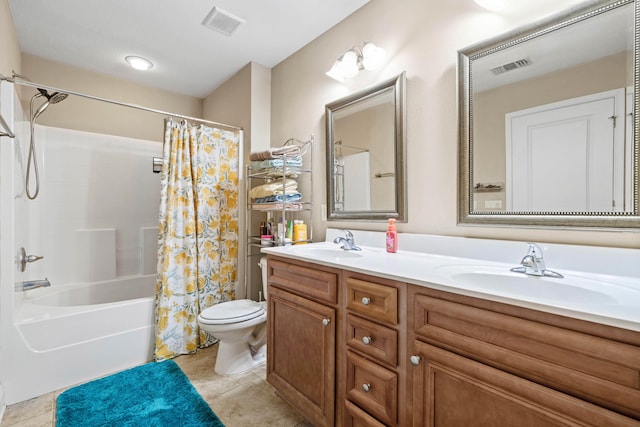 full bathroom with vanity, shower / bath combo with shower curtain, toilet, and tile patterned flooring