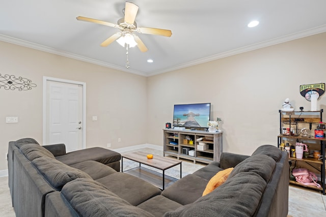 living room featuring ceiling fan, ornamental molding, and light wood-type flooring