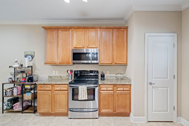 kitchen featuring crown molding, appliances with stainless steel finishes, light tile patterned floors, and light stone counters