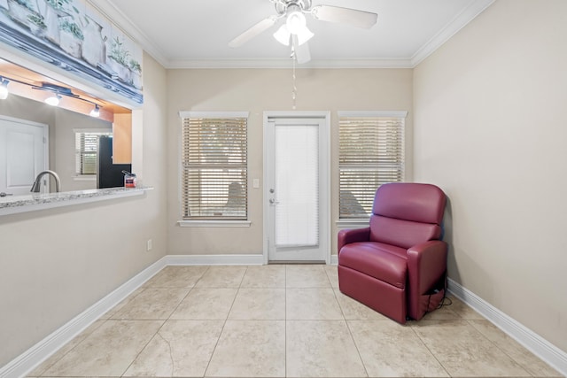 sitting room featuring crown molding, light tile patterned floors, and ceiling fan