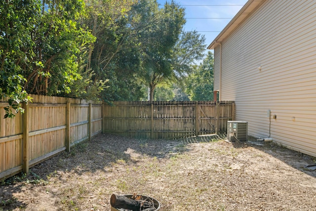 view of yard with central air condition unit