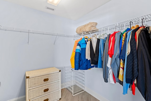 walk in closet featuring wood-type flooring