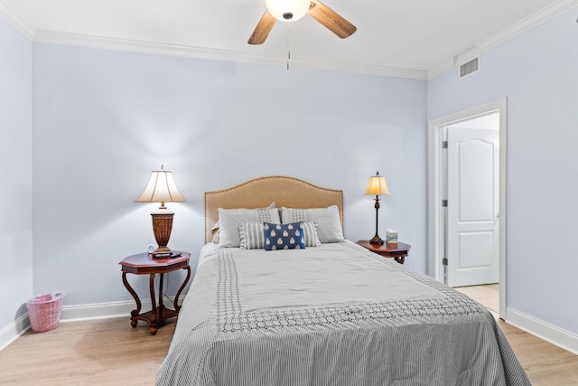 bedroom with crown molding, light hardwood / wood-style flooring, and ceiling fan