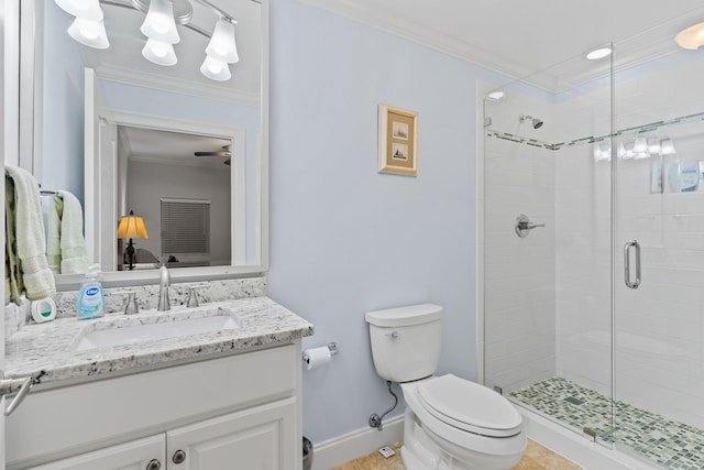 bathroom with vanity, toilet, ornamental molding, and a shower with shower door