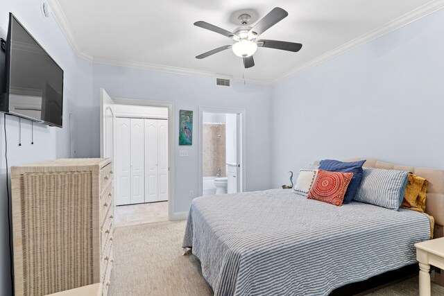 bedroom featuring ensuite bath, a closet, light carpet, ceiling fan, and crown molding