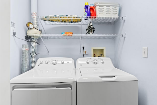 clothes washing area with washer and dryer