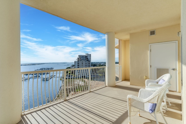 balcony featuring a water view