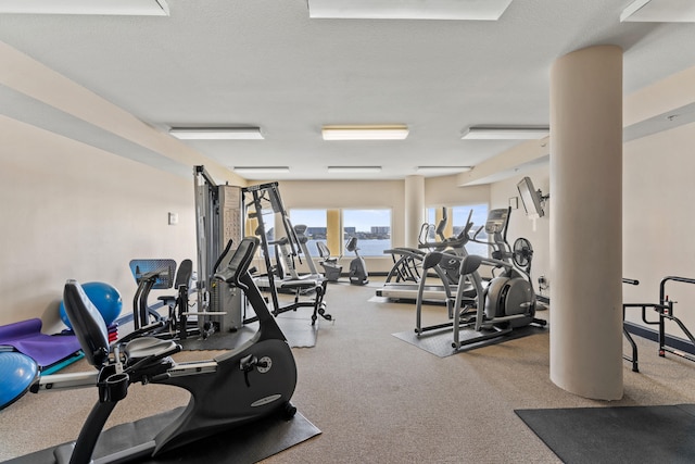 gym featuring a textured ceiling