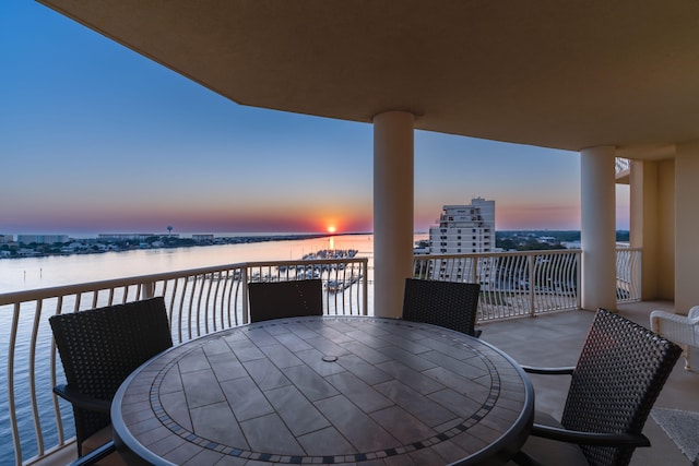 balcony at dusk with a water view