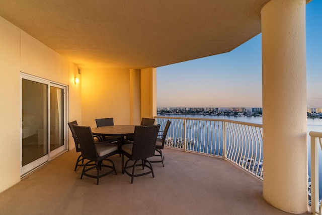 balcony at dusk with a water view