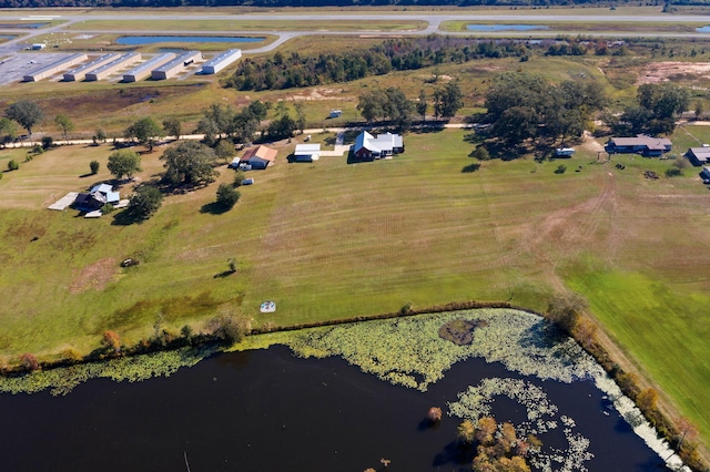 birds eye view of property featuring a water view and a rural view