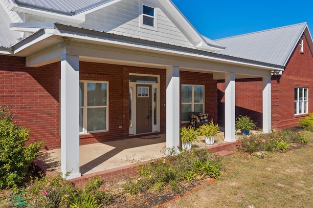 doorway to property featuring a porch