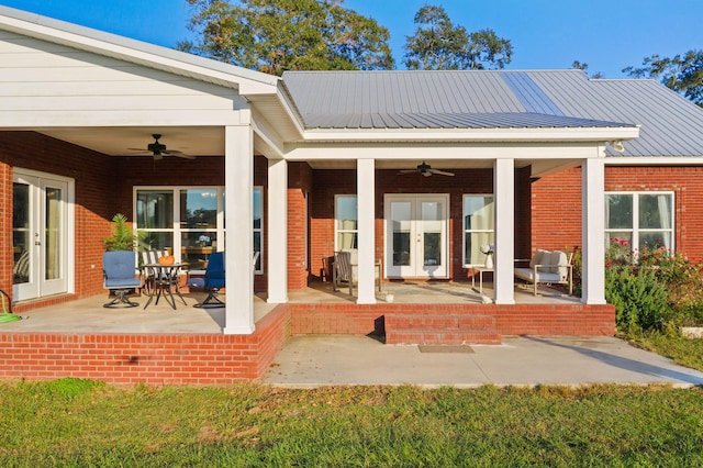 rear view of property with a patio area, french doors, and ceiling fan