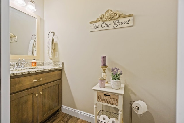 bathroom featuring vanity and hardwood / wood-style flooring